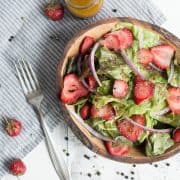 strawberry salad in bowl with fork