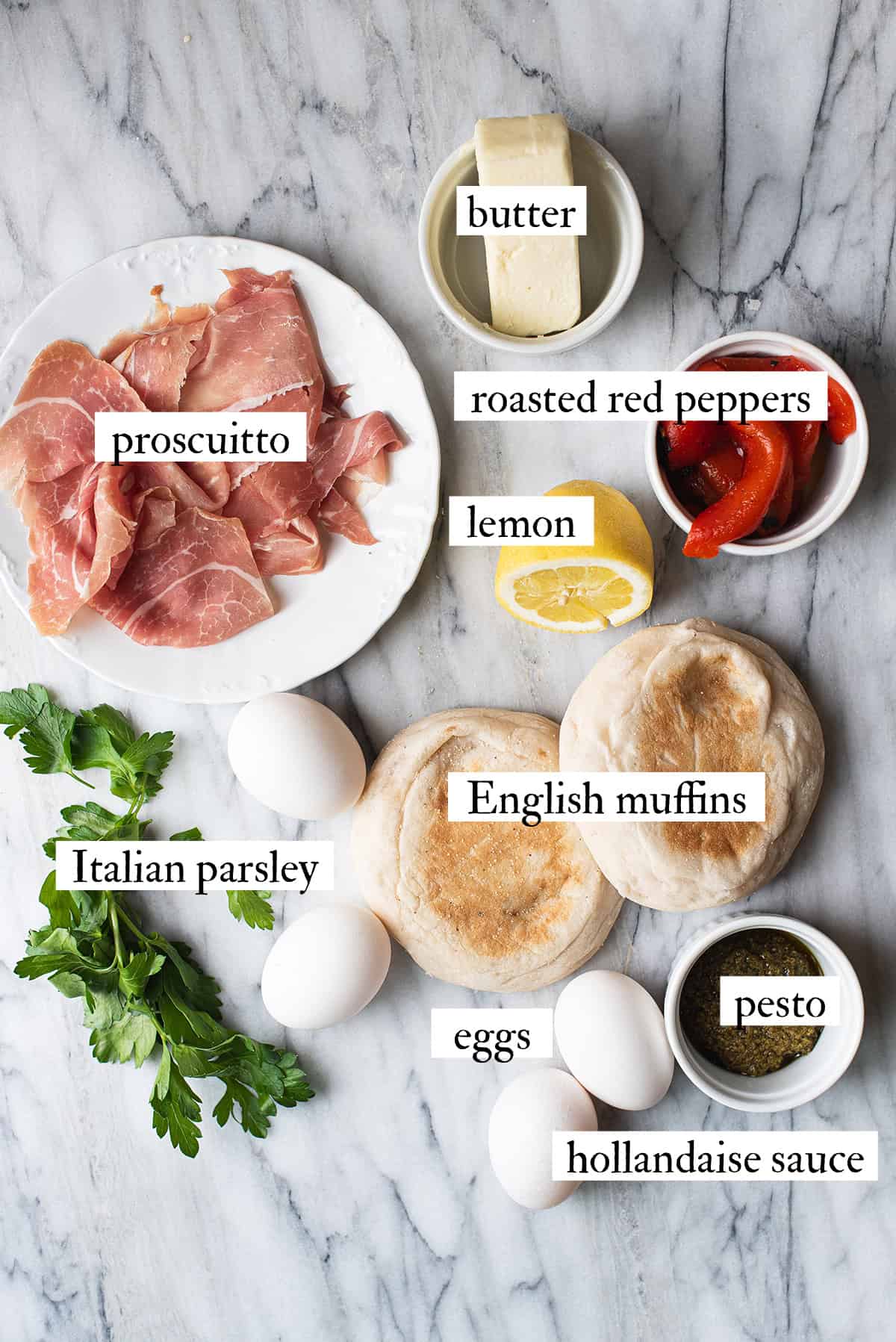 ingredients for Italian Eggs Benedict on marble countertop