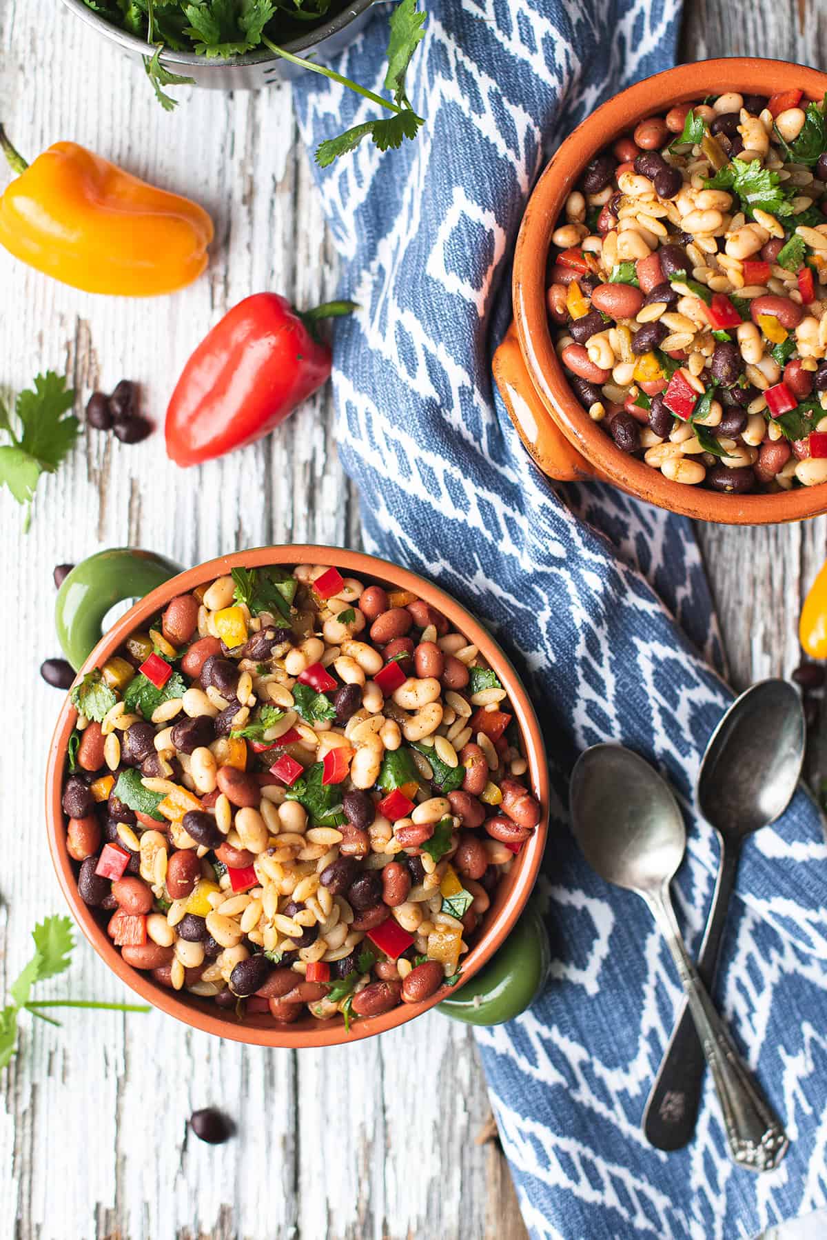 southwestern bean salad recipe made with mixed beans, orzo, fresh peppers, and cilantro
