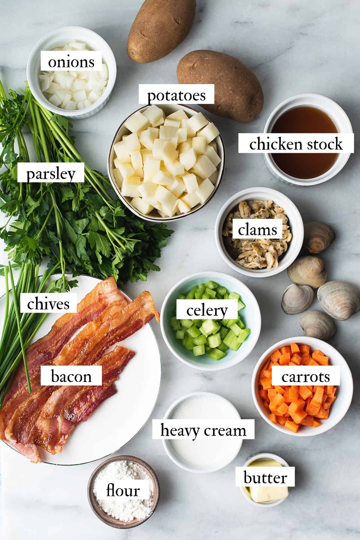 ingredients for clam chowder on marble surface