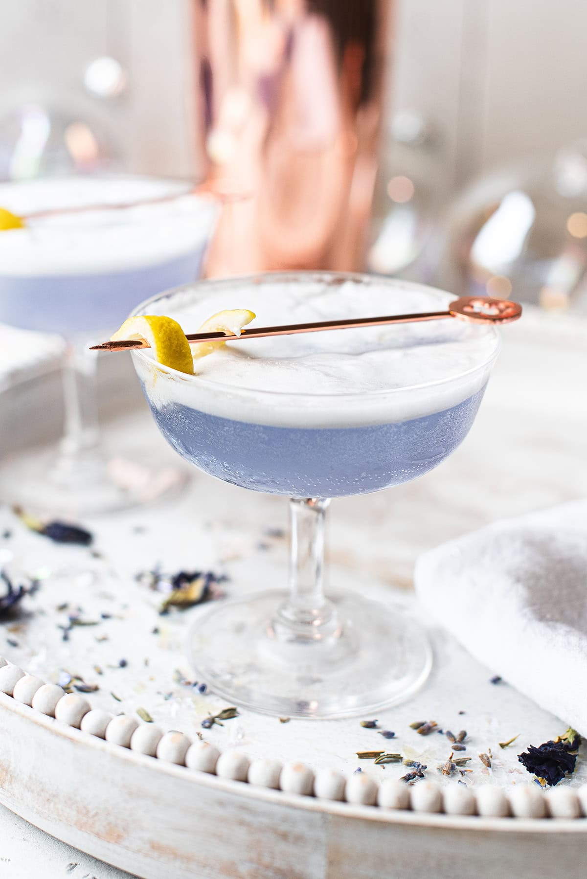 elegant shaken gin cocktail with elderflower and a frothy top
