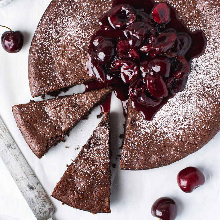 chocolate torte, sliced & topped with cherry compote