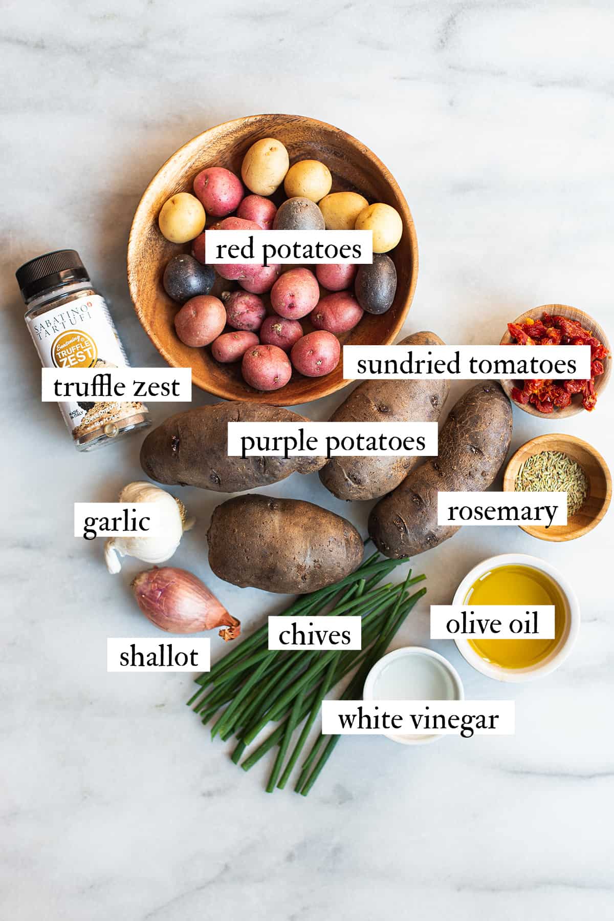 ingredients for red potato salad on marble countertop