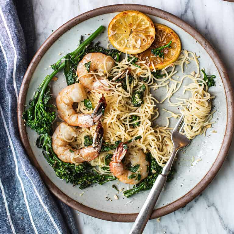 lemony shrimp pasta on plate, twirled on fork