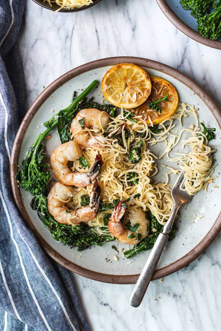 lemony shrimp pasta on plate, twirled on fork