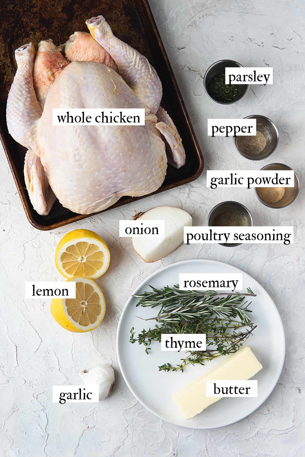 ingredients for roasted chicken spread out on counter top